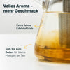 Teekanne aus Glas mit Stövchen